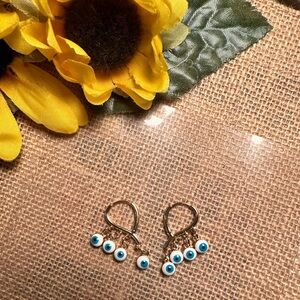 Gold toned evil eye dangle fashion earrings - NWOT 🧿